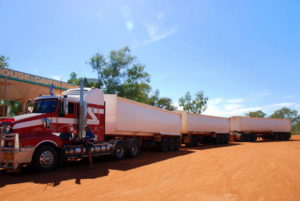 Triple road train - 16 foot longer than the width of a US football field. Carries up to 220 tonnes at 100 kph. 62 wheels (2 steer, 8 drive and 52 trailer). Operate only in the Australian Outback.