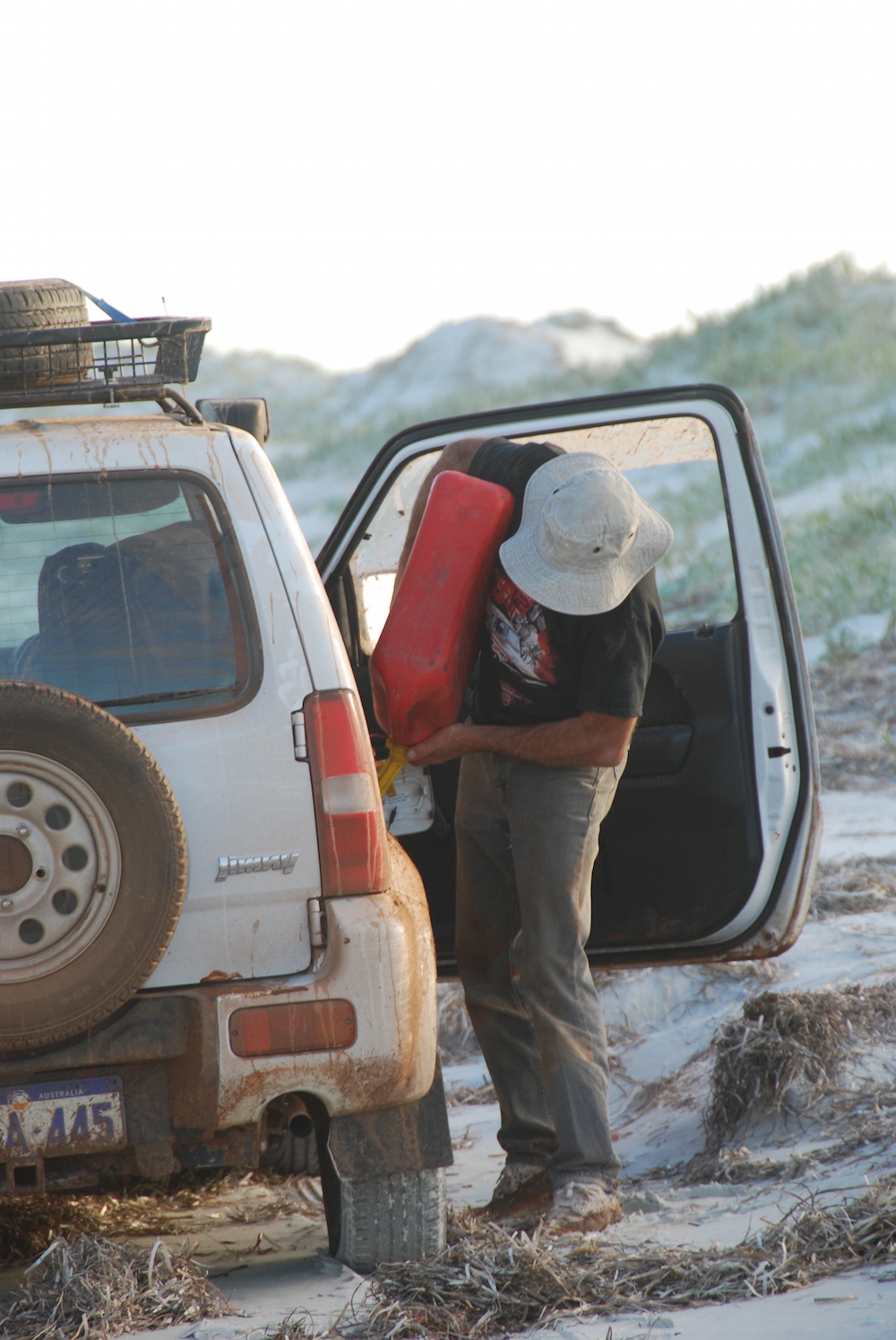 Greg refuelling the Jimny.