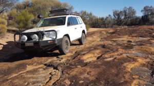 Phil's Toyota on a rocky outcrop where the Mt Jackson track disappeared.