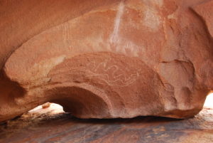 Aboriginal artwork on a striking holoclasty at Eagle Rock.