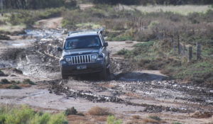 Nick negotiates the mud in his Jeep.