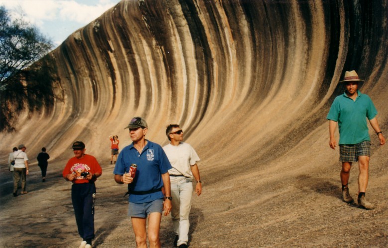 Playing tourists at Wave Rock.