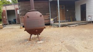 A WW11 vintage mine doing service as an incinerator at Wilga Hall.