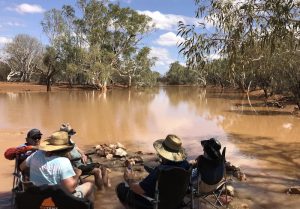 Support Crew sitting under the shade of a tree at the Milly Milly Crossing.