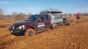 Navara and trailer bogged while seeking a path to the river.