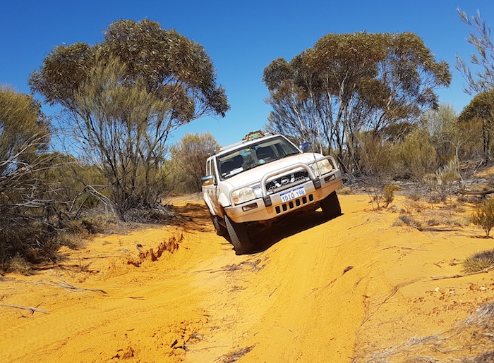 Kerry in his Navara negotiates the washaway.